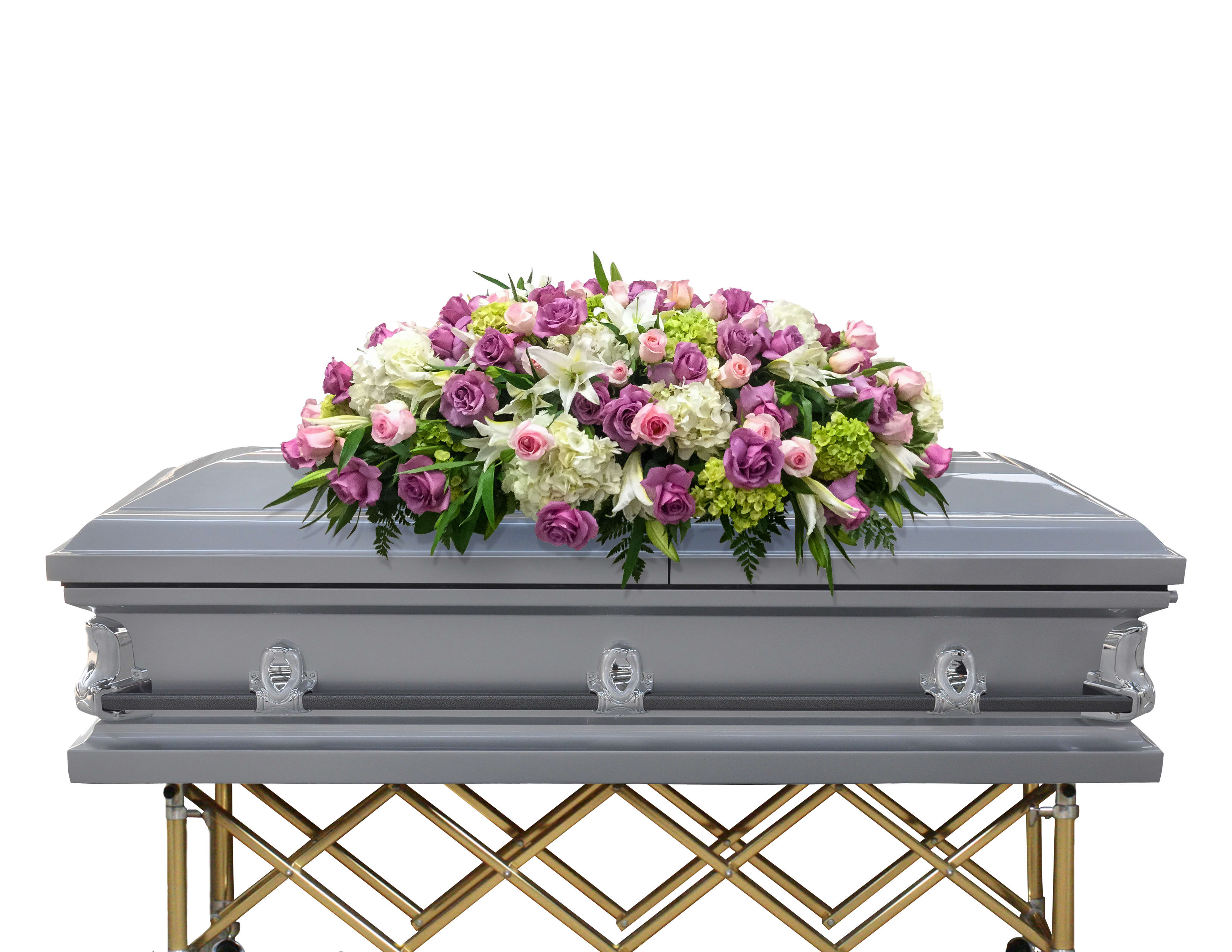 Pink and white floral casket spray on a silver casket