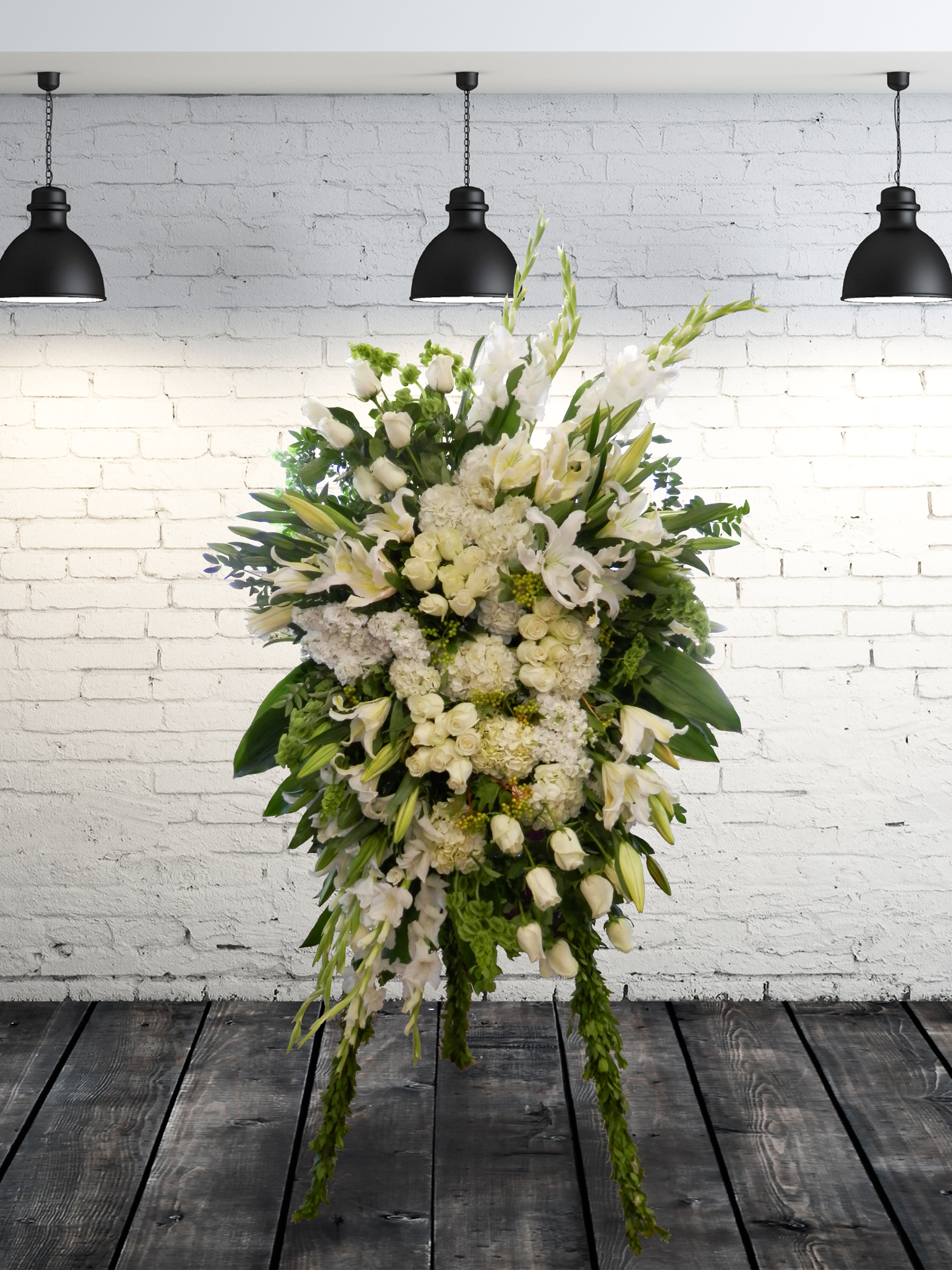 Large white floral standing spray with lilies and roses