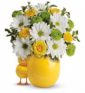 Yellow vase with daisies and roses, plus a small chick figurine
