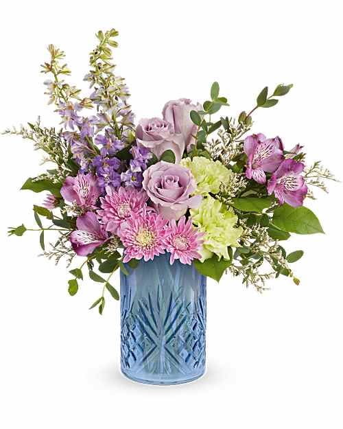 Garden Whimsy - Surprise Mom with Garden Whimsy Bouquet, a soft blend of lavender and pink blooms beautifully arranged in a Blue Belle Vase. This elegant Mother's Day gift adds fresh spring charm and lasting beauty to any space.