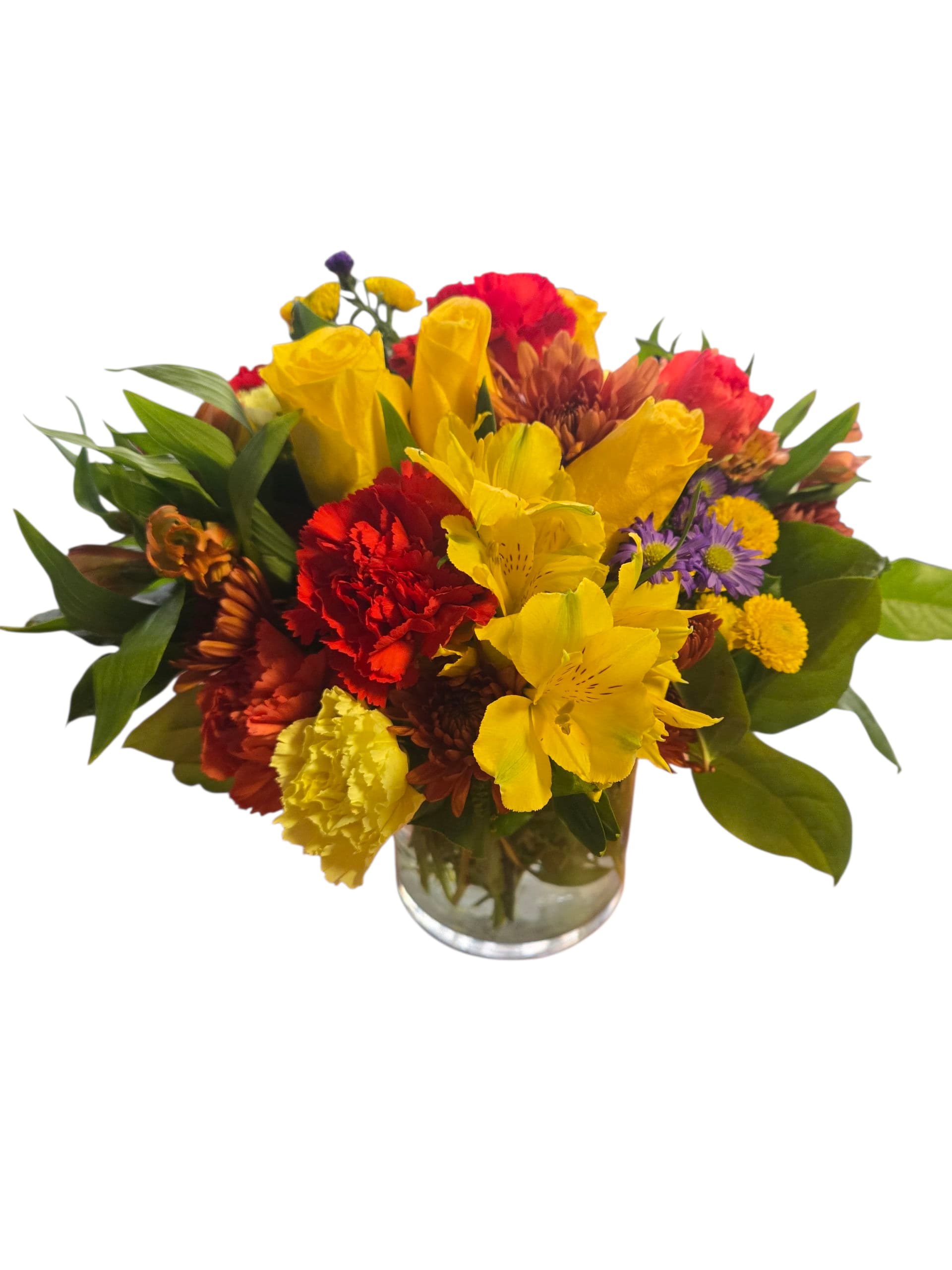 Mixed bouquet of yellow, red, and purple flowers in a glass vase