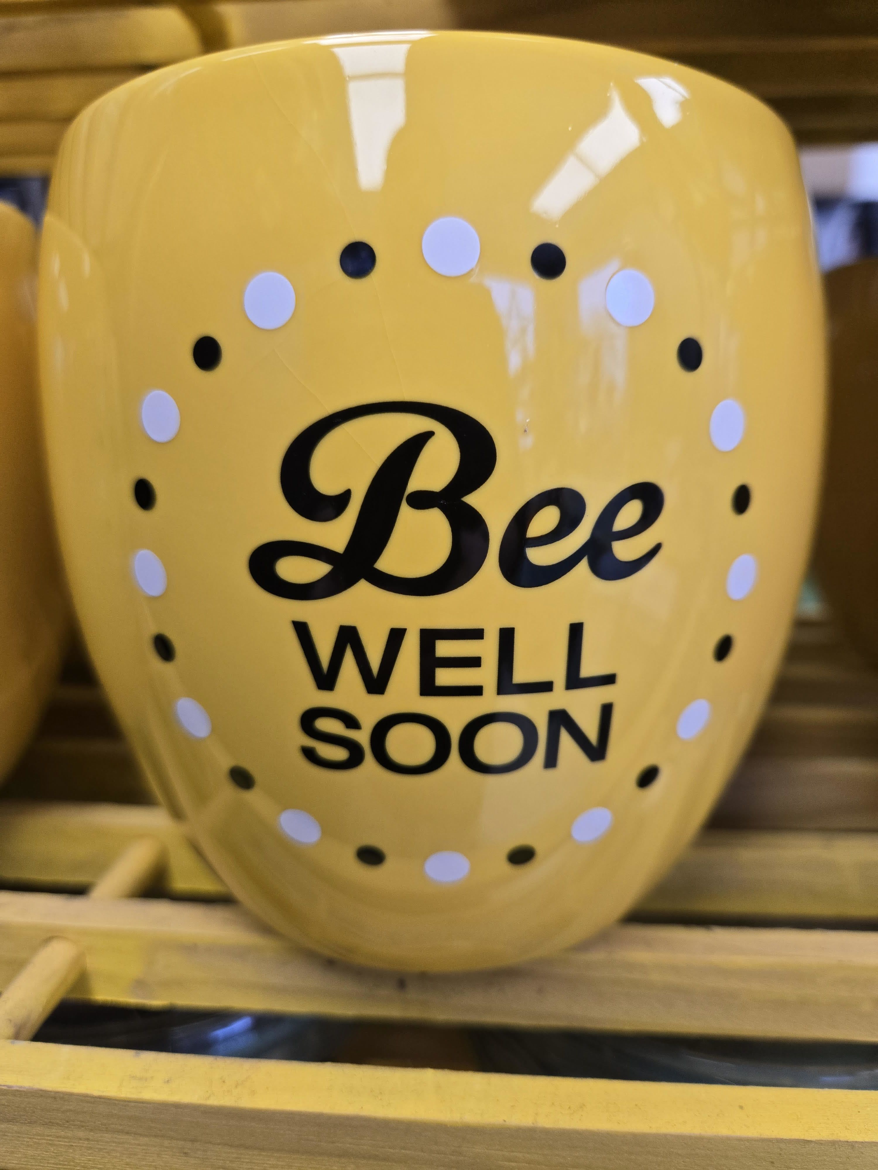 Yellow vase with "Bee Well Soon" text and polka dots