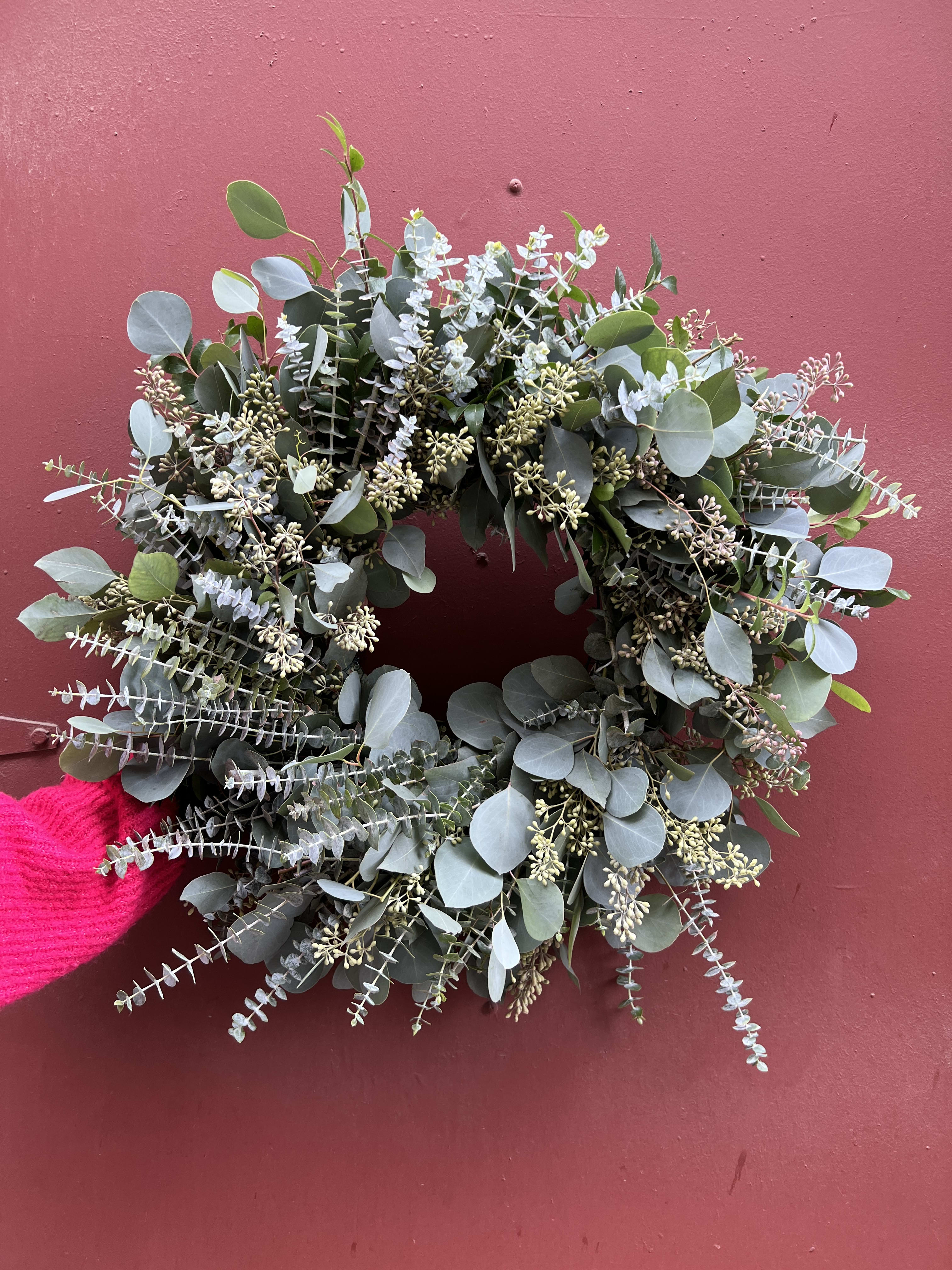 Fresh Eucalyptus Wreath - Celebrate the season with a beautiful hand made wreath full of eucalyptus.  Each wreath is hand made with fresh eucalyptus, smells amazing and will dry well so the recipient can enjoy the wreath all season.    Wreath size is approx. 22 in round.