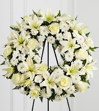Sympathy Standing Spray - Roses, lilies and poms. We can arrange this spray in the colors of your choice. 