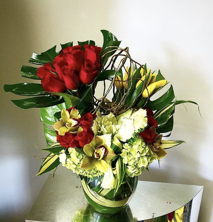 Be Mine  - Designer arrangement of red roses and tulips in a modern cylinder vase. 