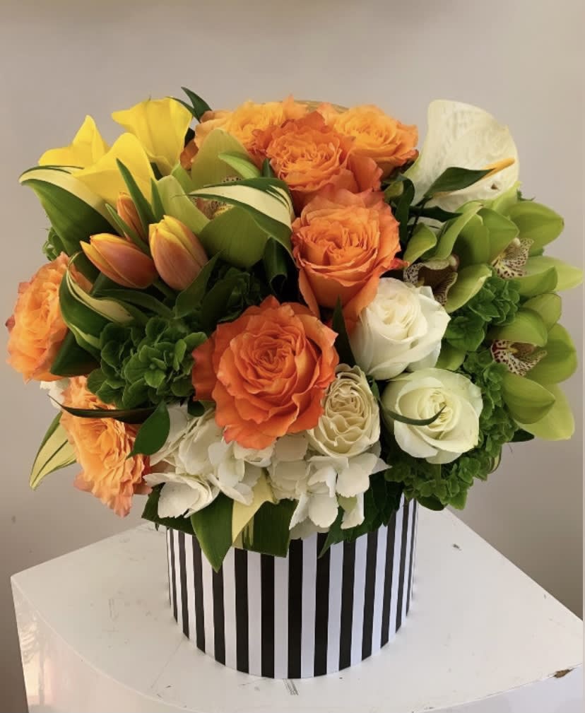 Sunset - Designer arrangement of gorgeous fresh blooms. 