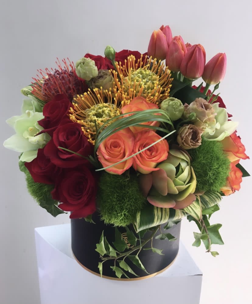 Gloria - Designer arrangement of gorgeous fresh blooms.