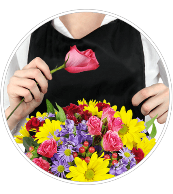 Person holding a pink rose above a colorful mixed bouquet