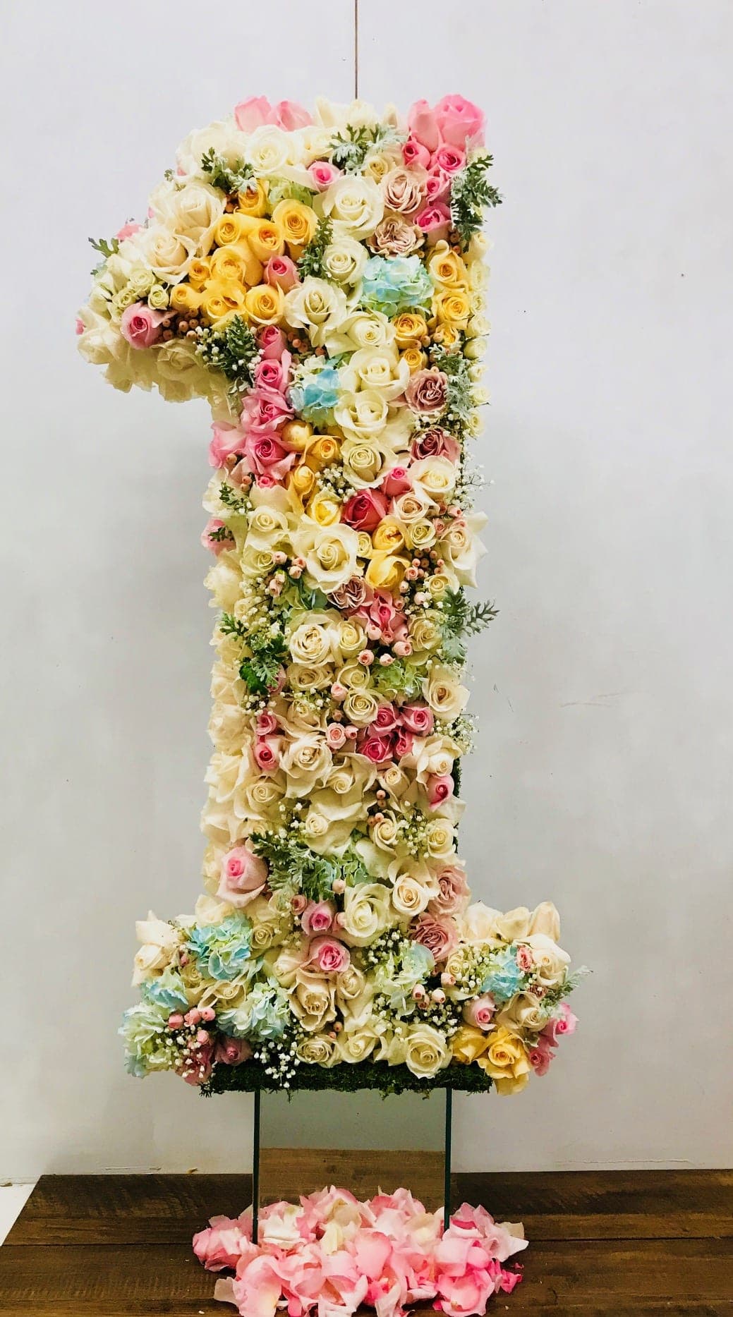 Large floral number one made of pastel roses and hydrangeas