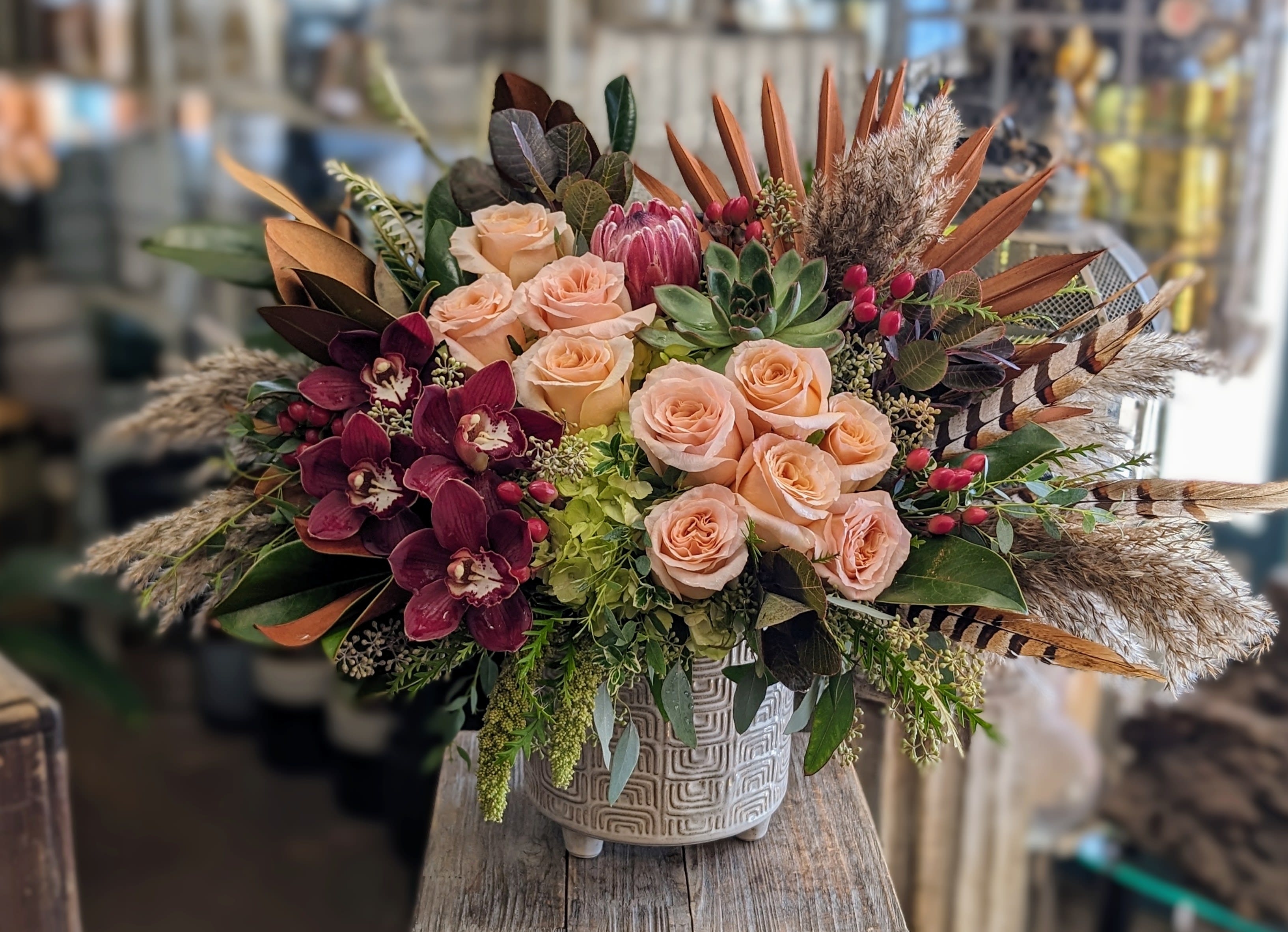 Hazel - A lovely seasonal look that includes roses, hydrangea, orchids, and a succulent.