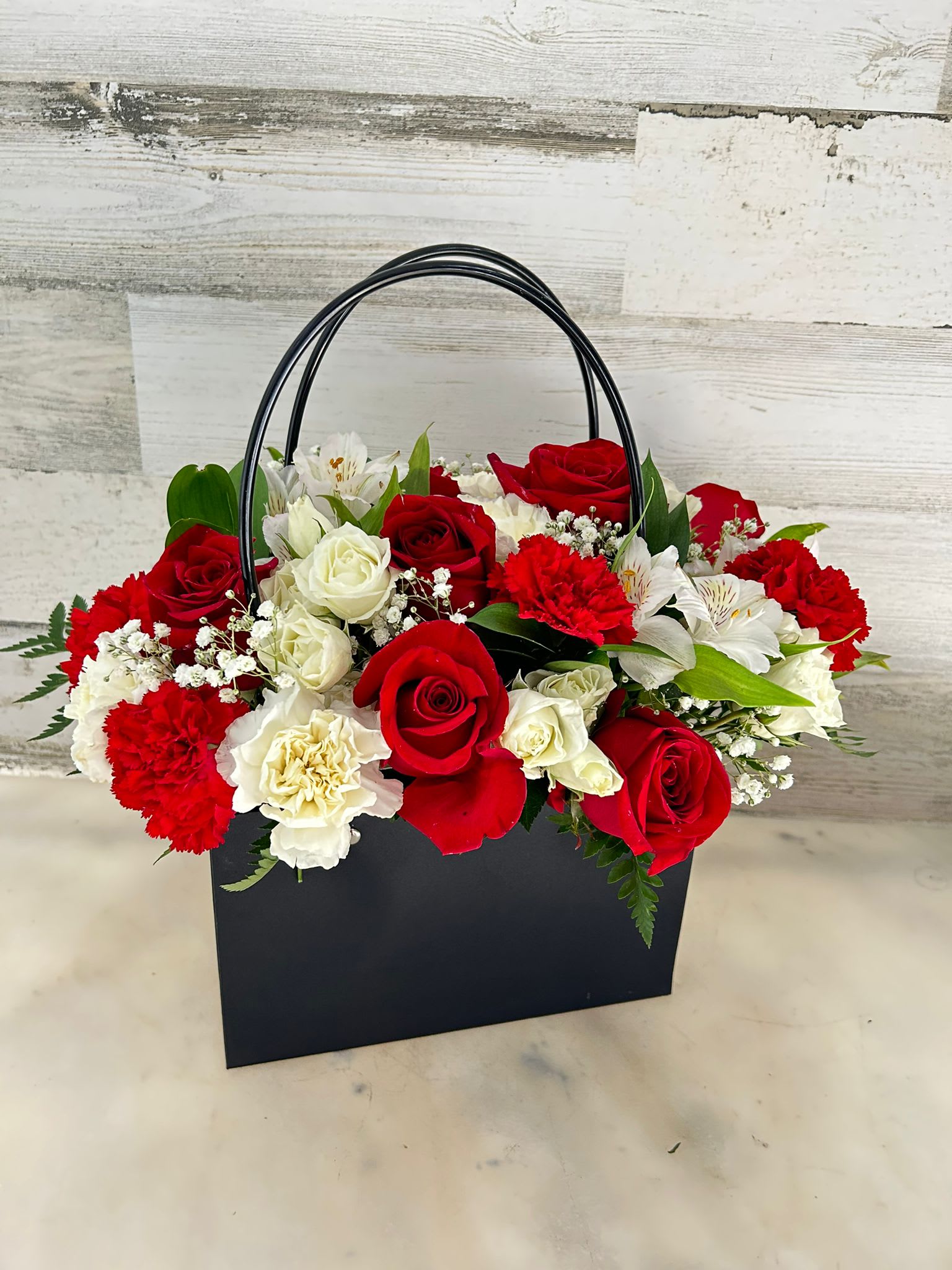 It's The  Purse - Beautiful an original arrangement with red and white flowers for any occasion!! with flowers such as red roses, whiter spray roses and white alstromelias 