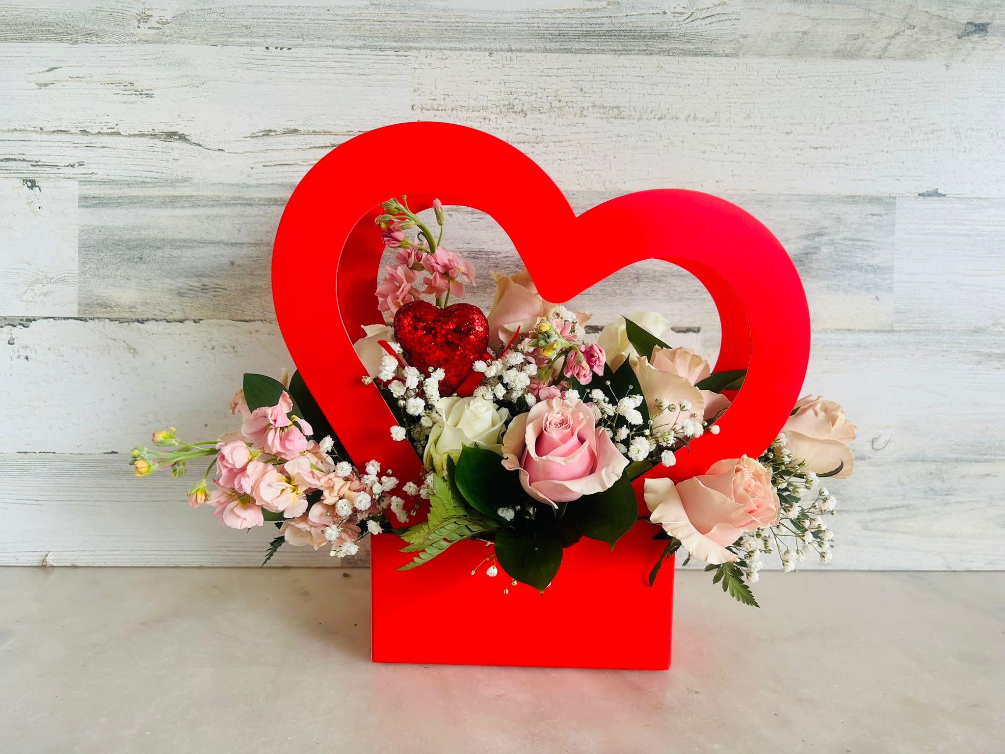 PINK HEART - Soft pink arrangement with a roses, stock, babies breath in a nice box with heart shape. 