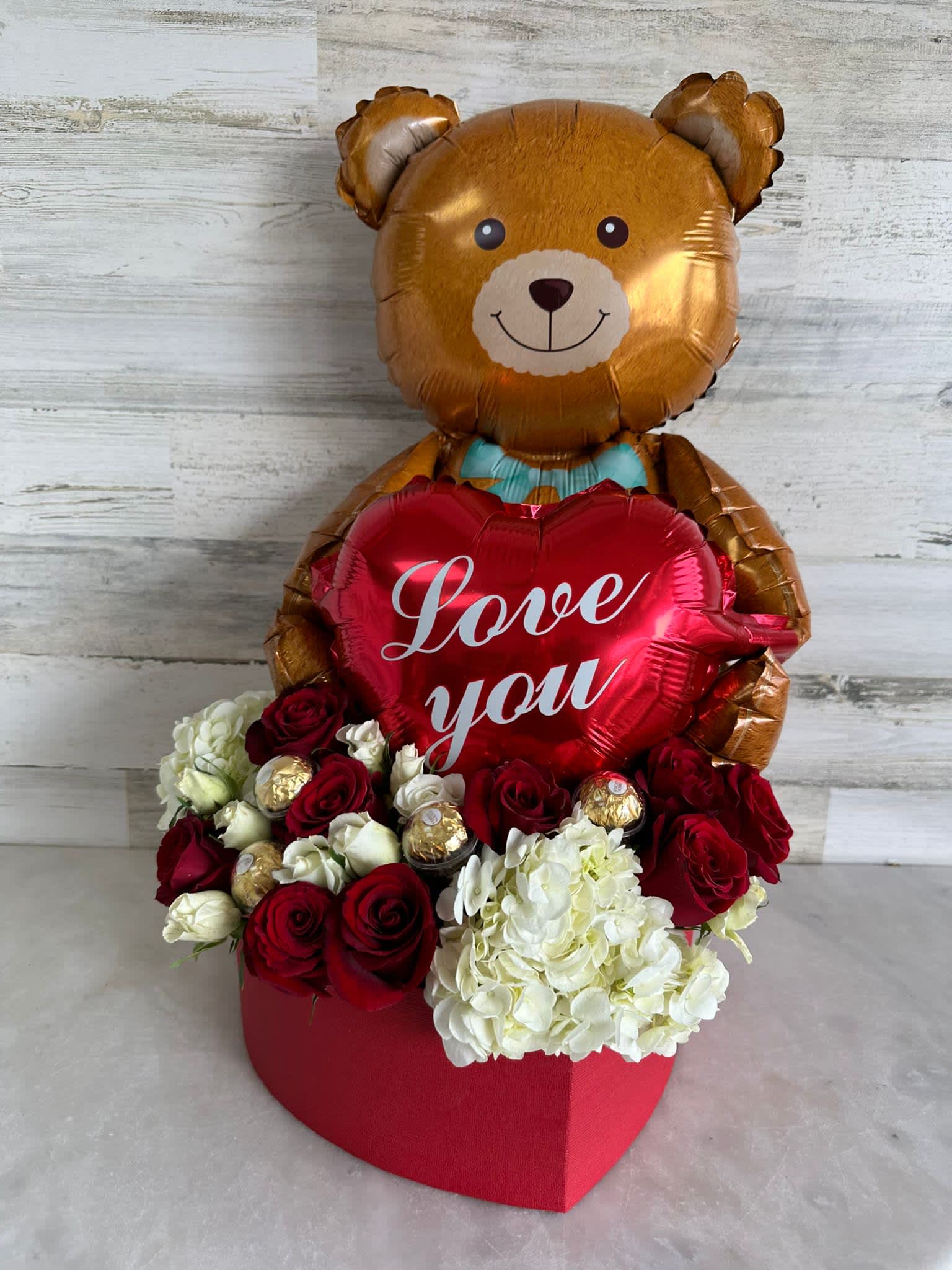Bear Box - Nice heart shape box with roses, hydrangea and spray roses tide in the same box a pretty bear and sweet message , perfect to any moment to show to your loved one how big it's your love.