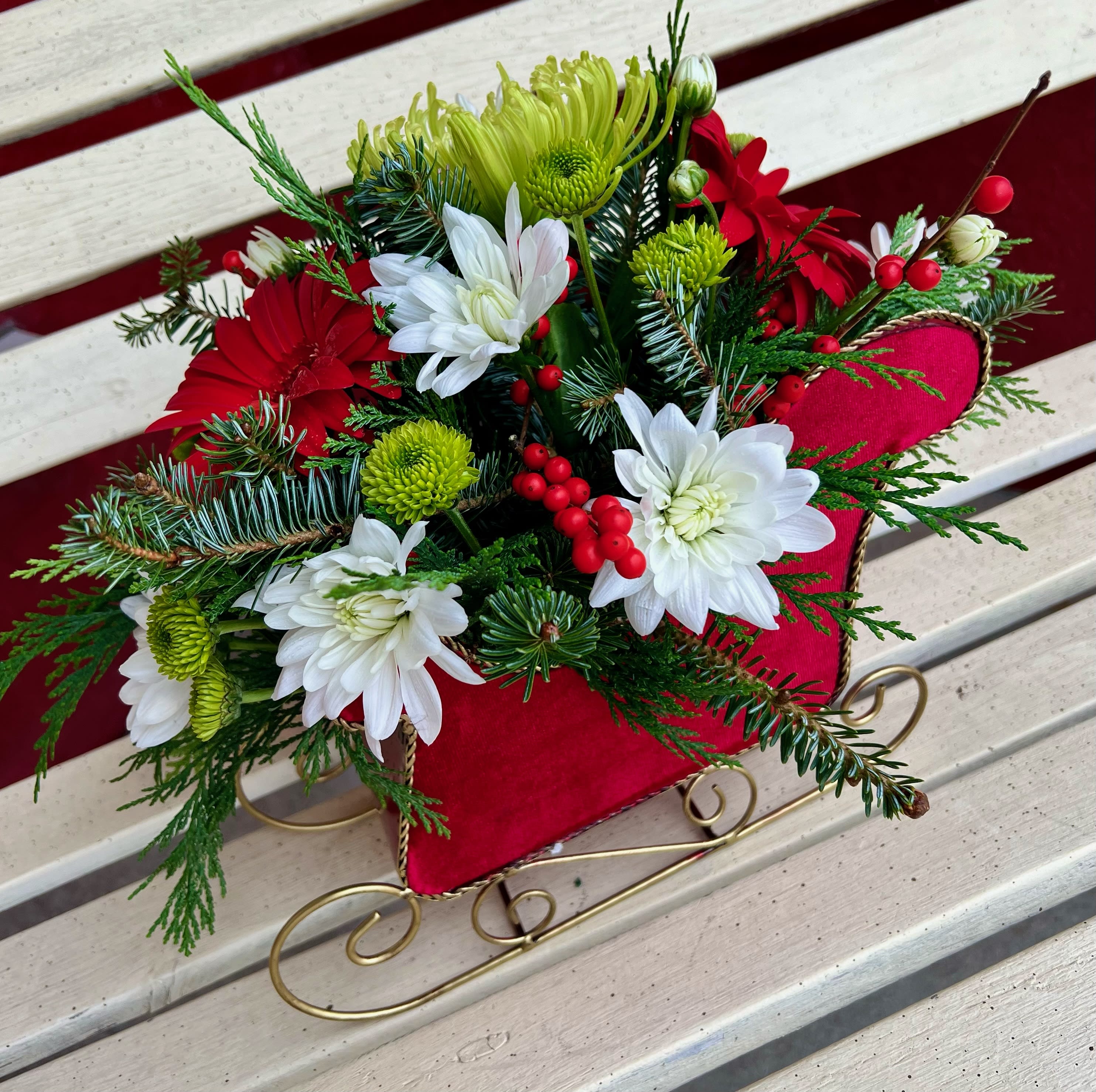 Sleigh All the Way - This beautiful Sleigh is filled with fresh seasonal flowers and foliage. Perfect for any occasion. We promise to keep the same color, style, and overall theme with what Mother Nature generously blesses us with)