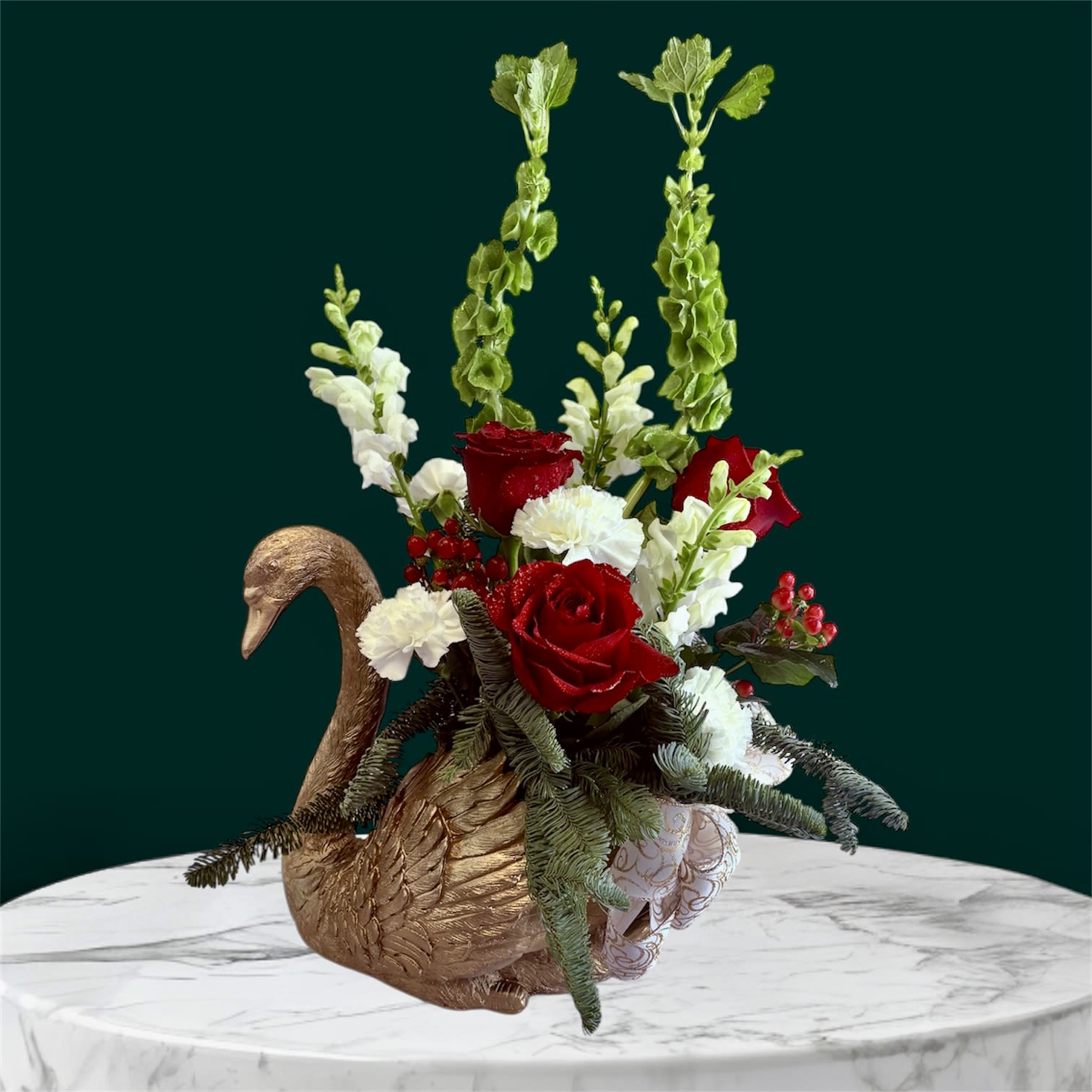 Swan Song - A stunning fresh floral arrangement designed in a keepsake swan planter symbolizing beauty, devotion, and timeless elegance. A wonderful choice for any occasion offering a keepsake that will be treasured long after the blooms fade. 