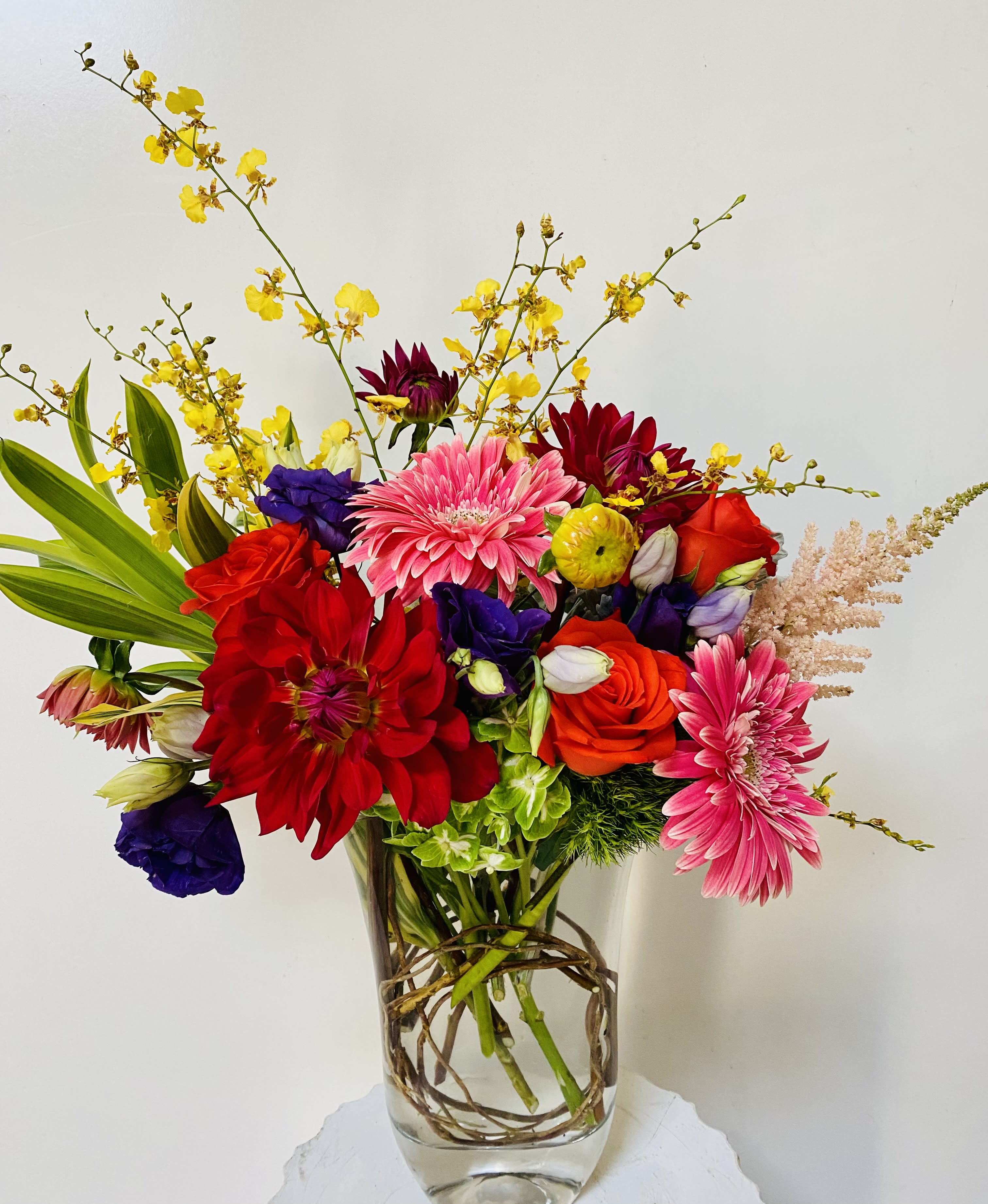 Colorful mixed bouquet in a clear glass vase