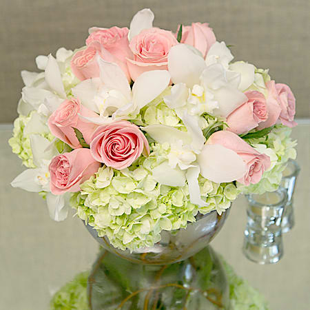 Cutie - This arrangement has the dimensions of: a head of 14" and a height of 14". The design features white hydrangeas, pink roses and white orchids. This wonderful arrangement is brought to you by My Beverly Hills Florist and it has the exciting ability to show how much you care for someone with its living color.