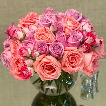 50 Muli Color roses  - 50 Multi color roses and Spray roses in a classic fishbowl.  Deluxe: 75 Roses Premium: 100 Roses 