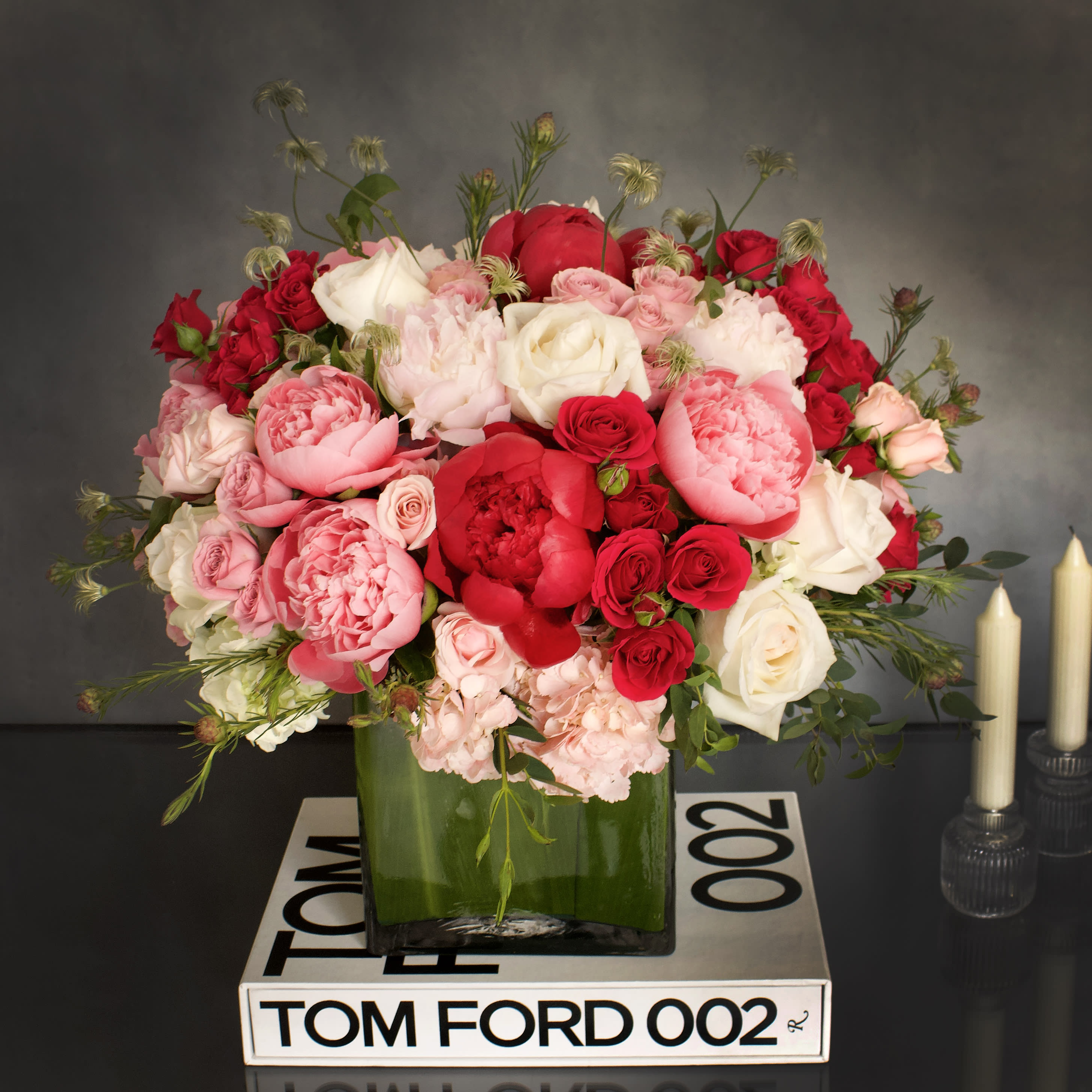 Destiny  - "Destiny" is a bright and vivid arrangement, filled with hot pink florals. Arranged with Peonies, various Roses and Hydrangeas, along with seasonal greens. A beautiful way to brighten any day!   Measurement:  Vase: 8x8 Arrangement: 20x21 