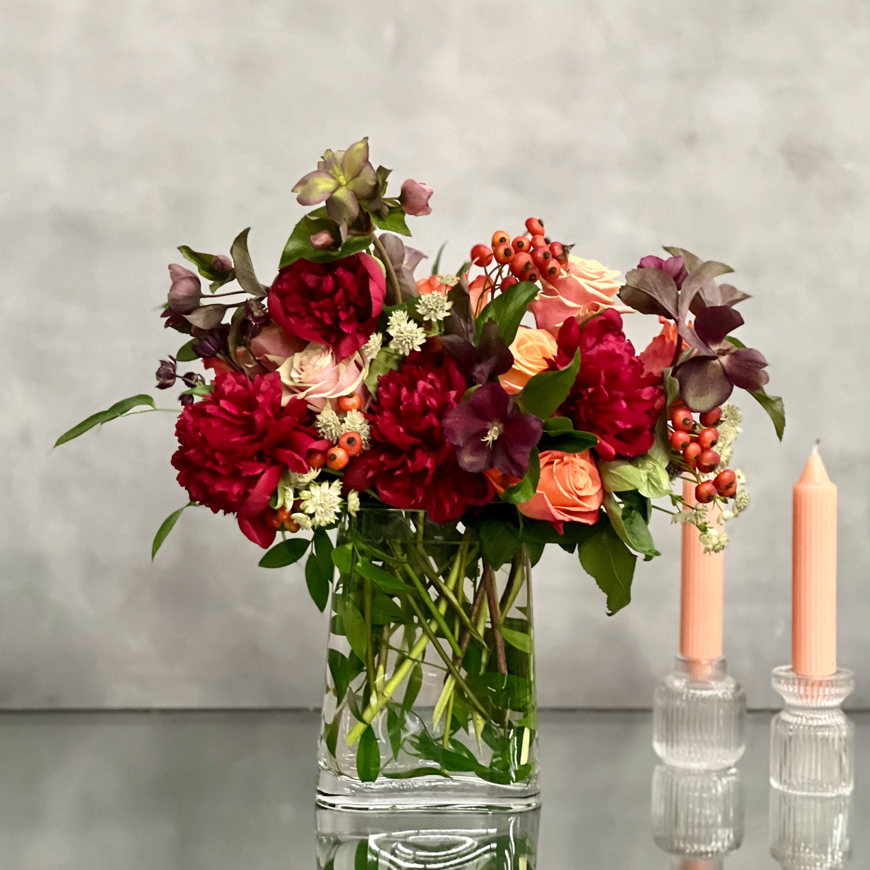 Peonies Please -  Valentine Edition - A majestic combination of orange roses, burgundy peonies and a variety of winter elements from My Beverly Hills Florist, beautifully accented in a glass vase. This stunning arrangement creates a breathtaking birthday gift that artfully combines radiant colors to express admiration and appreciation. An unforgettable way to show you care!