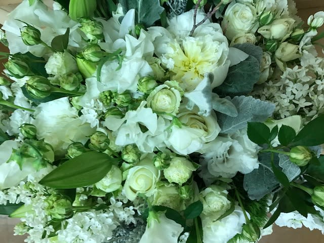 Elegant Whites  - Elegant white medley presented in an 8" x 8" clear glass or ceramic vessel.  *Each arrangement is unique and ingredients may vary slightly. Floral designers will preserve the overall shape, size, style, and color scheme.
