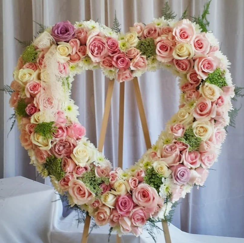 Our Sweetest Memories Heart Wreath - Open Heart Wreath (24") with pink and lavender roses, Queens Lace, and cushion mums.