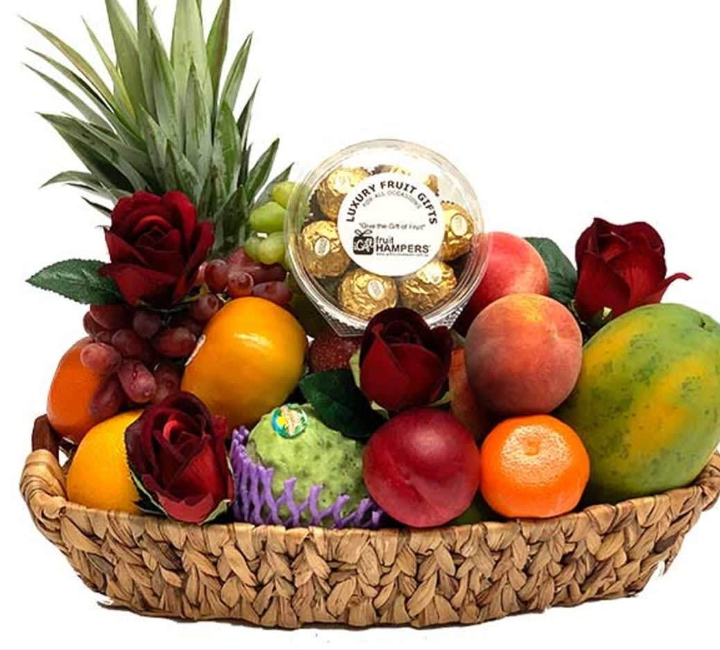 Fruit basket with roses and a box of chocolates