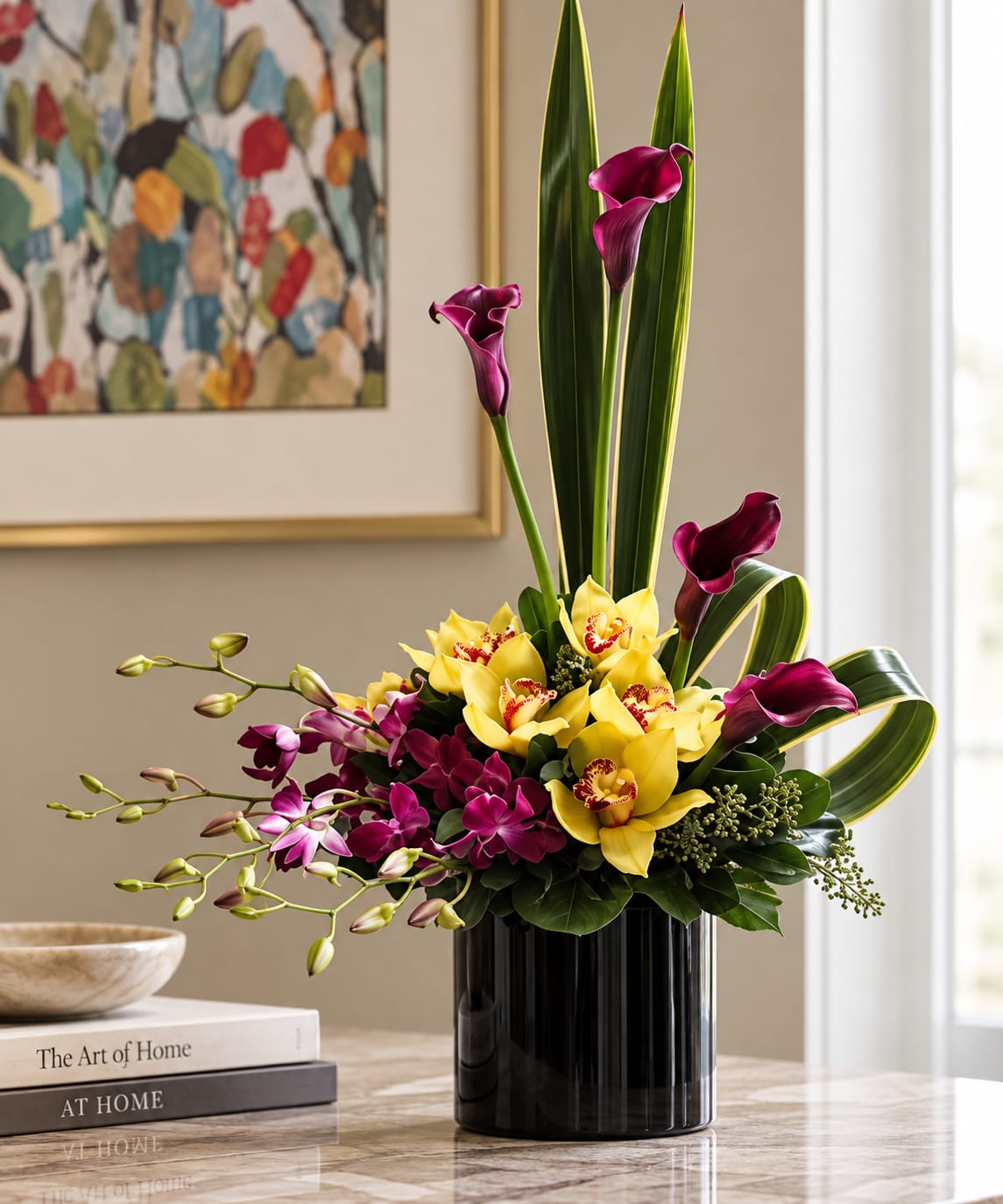 Purple calla lilies and yellow orchids in a black vase
