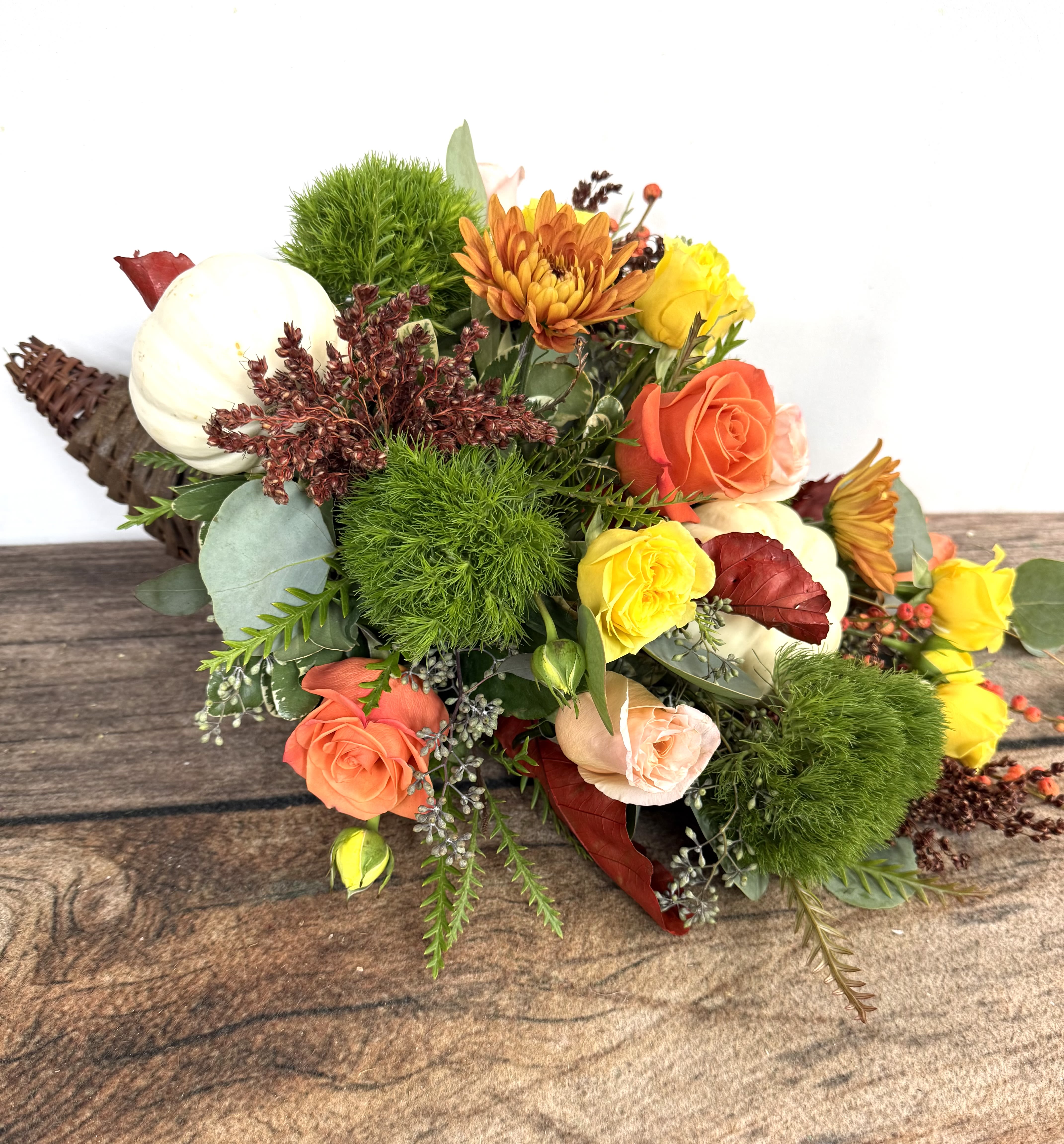 Mixed bouquet with roses, chrysanthemums, and green pom-pom blooms