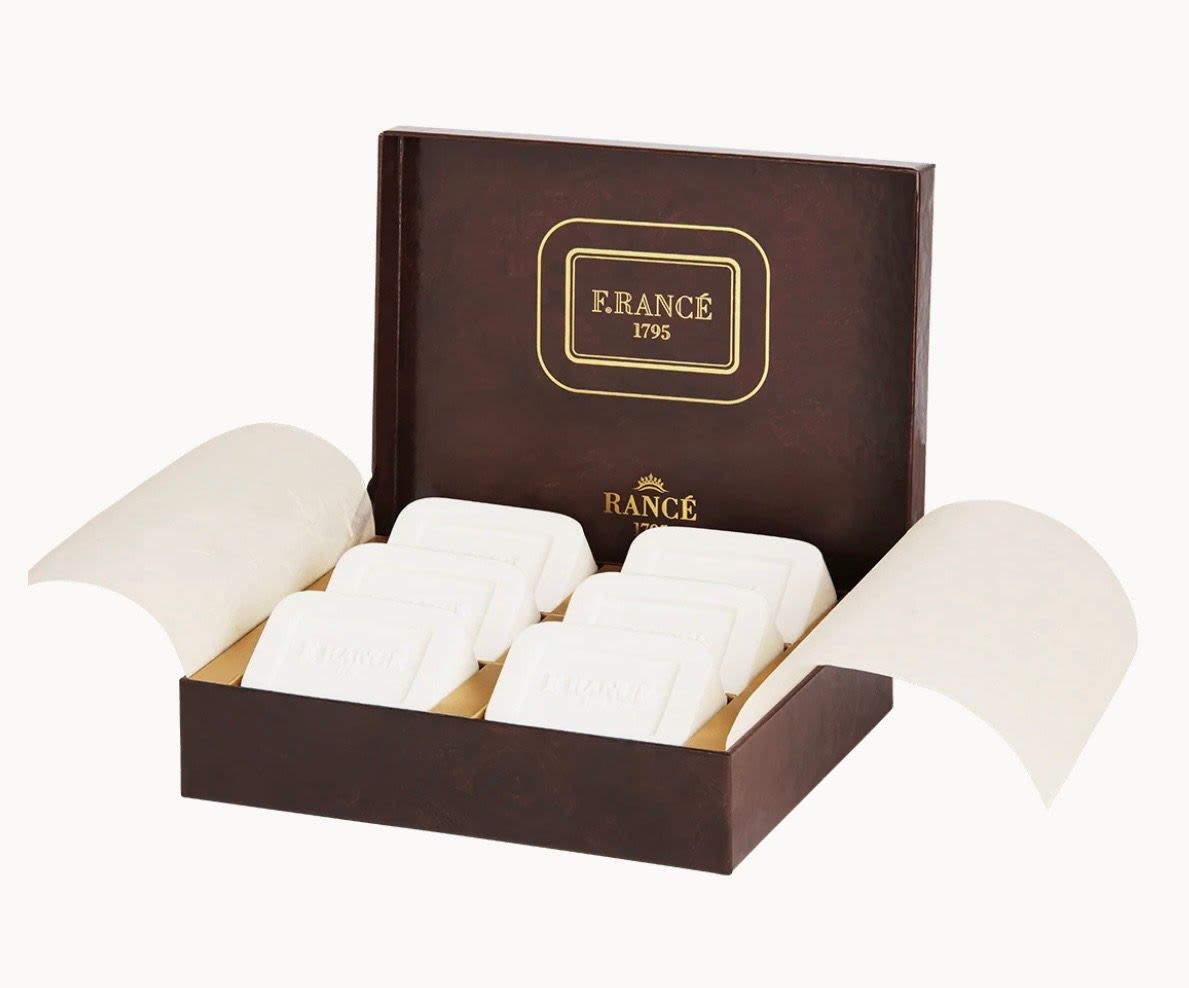 Box of white wrapped chocolates in a brown gift box