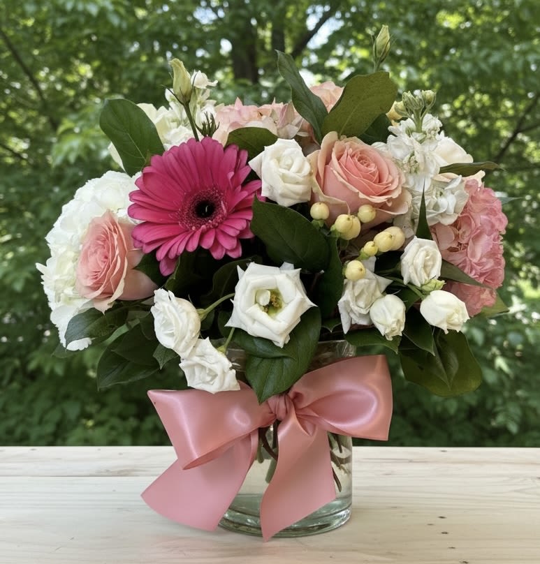 Cotton Candy - Cotton Candy | Wilmington, Delaware Florist  Delight in the soft, sweet charm of our Cotton Candy floral arrangement, exclusively created by Petals Flowers and Fine Gifts — your trusted local florist in Wilmington, Delaware. This elegant design features fluffy white hydrangea, pale pink roses, vibrant dark pink roses, pink lisianthus, and lush greenery, all beautifully arranged in a clear cylinder vase and finished with a delicate pink satin ribbon. The gentle blend of pink hues evokes the whimsical feel of cotton candy, perfect for any joyful occasion.  Ideal for birthdays, anniversaries, baby showers, or just because, Cotton Candy brings a fresh, romantic touch to homes, offices, and special events throughout Wilmington and the surrounding communities.  As a boutique florist in Wilmington, Delaware, we pride ourselves on crafting custom, premium floral arrangements using the freshest blooms. We offer same-day, tax-free flower delivery across Wilmington, Hockessin, Newark, Glen Mills, Chadds Ford, Kennett Square, and nearby areas — all backed by our satisfaction guarantee.  Why Choose Us?  * Locally owned Wilmington florist known for quality and creativity * Personalized service with attention to detail in every arrangement * Reliable same-day delivery to your doorstep or your loved ones’ Order Cotton Candy today and let Petals Flowers and Fine Gifts bring a sweet, elegant floral experience to Wilmington, Delaware.