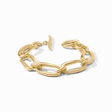 Wave Link Bracelet - Gold Julie Voss Wave Link Bracelet  Discover the art of giving at Petals, Wilmington, Delaware’s destination for luxury gifts and home décor. Our curated collection features beautifully crafted items for every occasion — birthdays, weddings, anniversaries, holidays, and life’s special celebrations. At Petals, we believe every gift should tell a story. From hand-poured candles and elegant keepsakes to stylish home accents, gourmet treats, and floral-inspired décor, our selection combines timeless charm with modern sophistication. Each piece is chosen with care to reflect the quality, creativity, and personal touch our Wilmington customers love.  Same-day delivery available throughout Wilmington and nearby areas including Greenville, Hockessin, Newark, and the Brandywine Valley Whether you’re looking for a thoughtful hostess gift, a luxury home accent, or something simply beautiful to brighten someone’s day, Petals offers fine gifts and personalized service that make every occasion memorable. Visit our Wilmington boutique or shop online today — and see why Petals is Delaware’s trusted name for fine gifts and inspired giving.