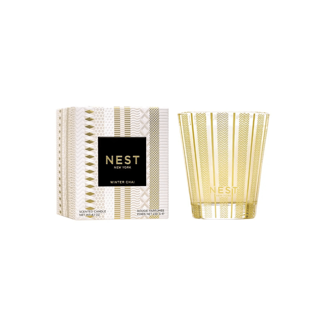 Nest New York Winter Chai scented candle with a patterned box and glass tumbler
