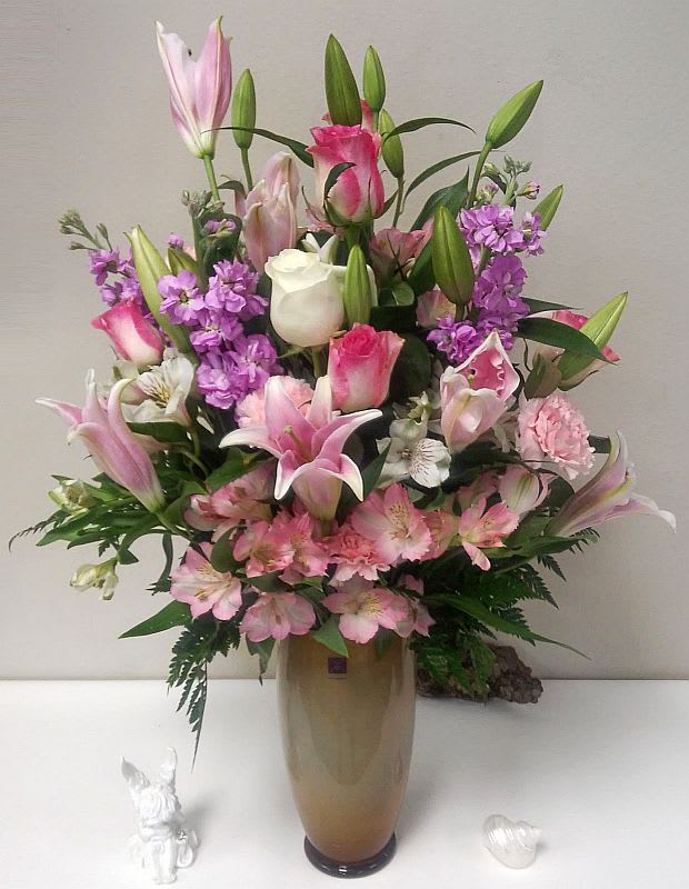 Pink and white mixed bouquet in a tall vase