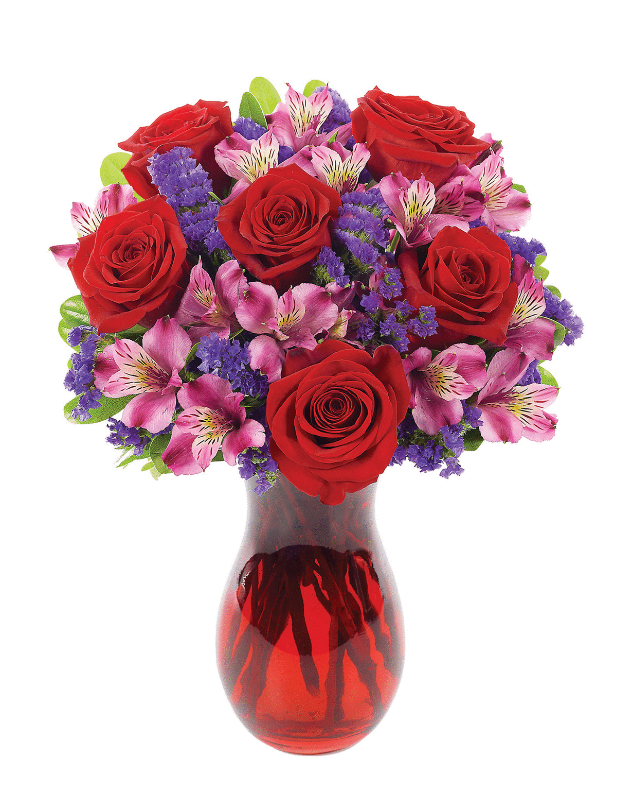 Red roses and pink flowers arranged in a red glass vase
