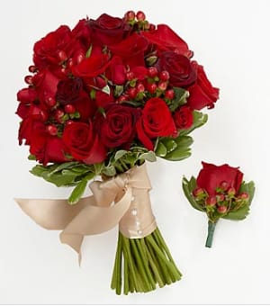 Bouquet of red roses with a beige ribbon and matching boutonniere