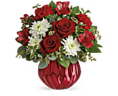 Red roses and white daisies in a red vase