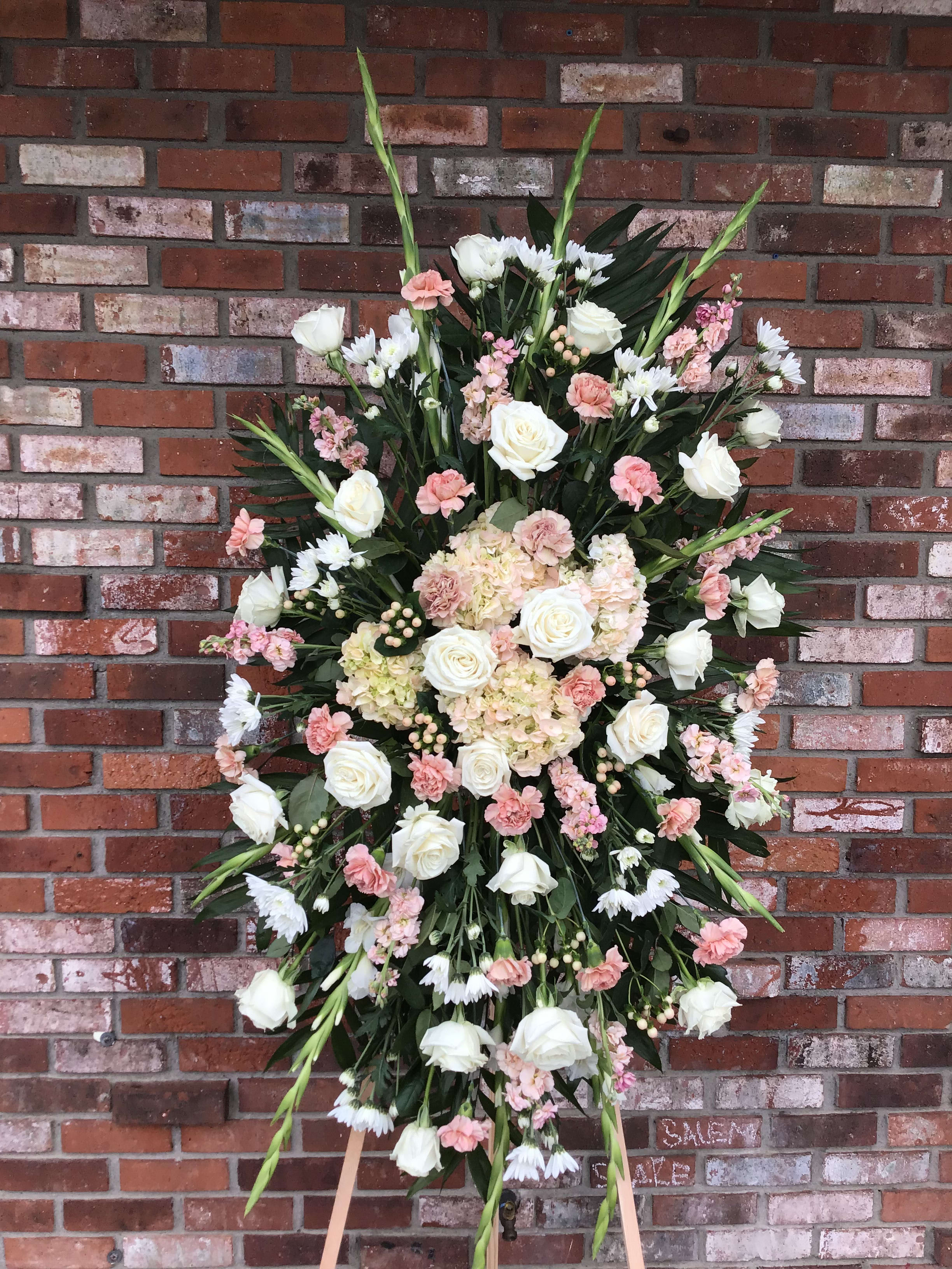 Standing floral spray with white roses and pink blooms