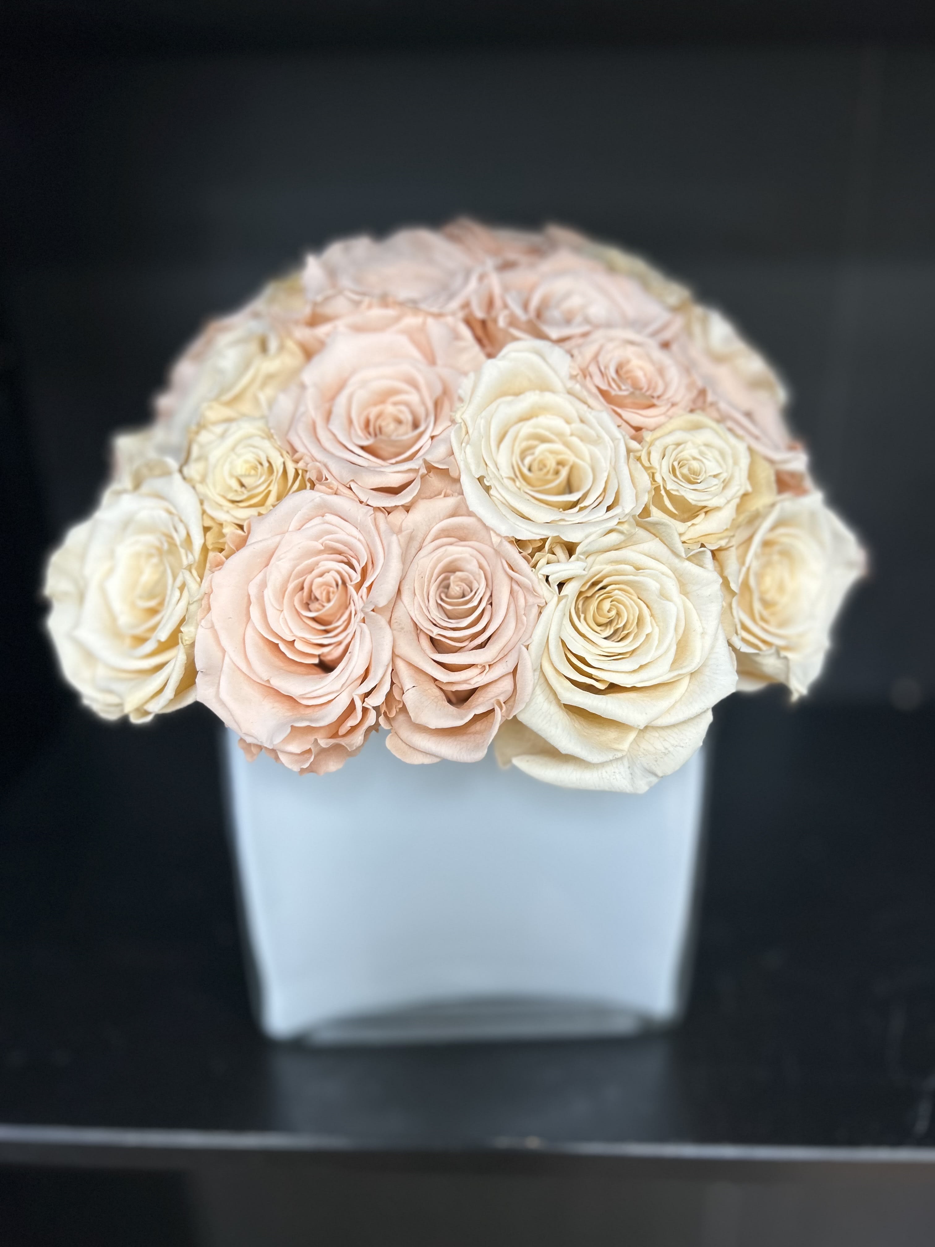 Bouquet of blush and ivory roses in a white box