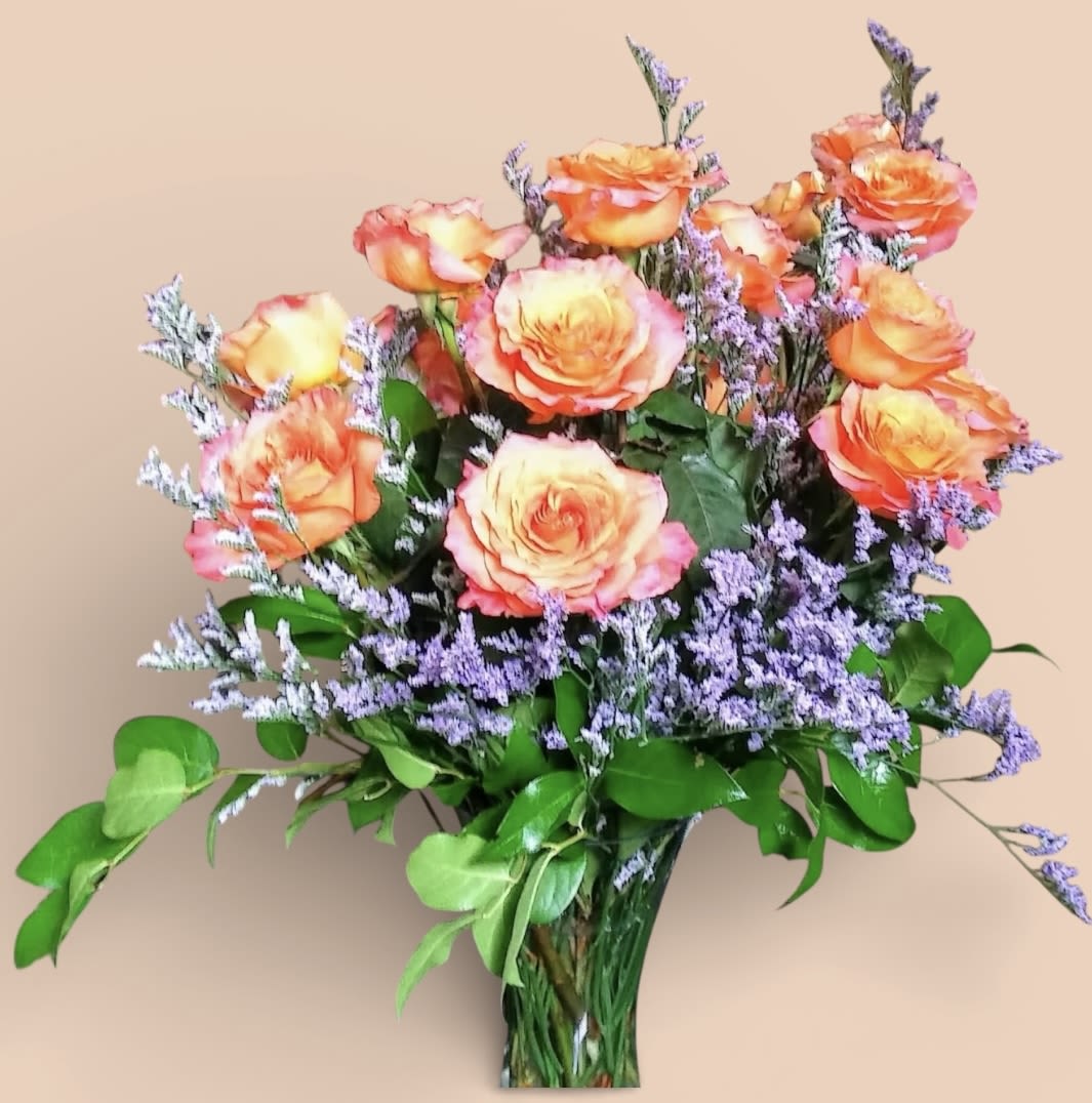 A Dozen Bi-Colored Roses - Please note bi-color roses vary in color, they may not be the color pictured they may be other colors. When you want to send a dozen roses – with a slightly more creative touch – these bi-colored roses are a beautiful gesture. The two-toned petals make an artistic statement, and the long-stemmed size will also impress.