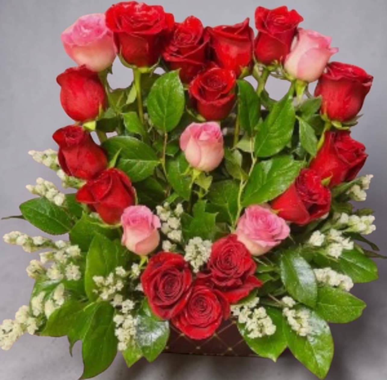 Love of my life  - 18 roses Custom design of roses in a beautiful heart shape to express the love of your heart. Rose color and container may vary 