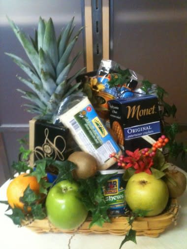 Fruit and Snack Basket - This is a great gift for any occasion. This basket is filled with a variety of fruits, snacks and chocolates. 