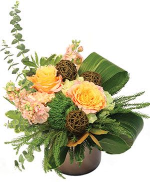 Bouquet of peach roses and pink flowers in a brown vase
