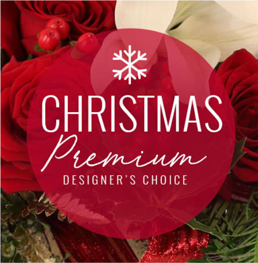 Red roses with white flowers and Christmas text overlay