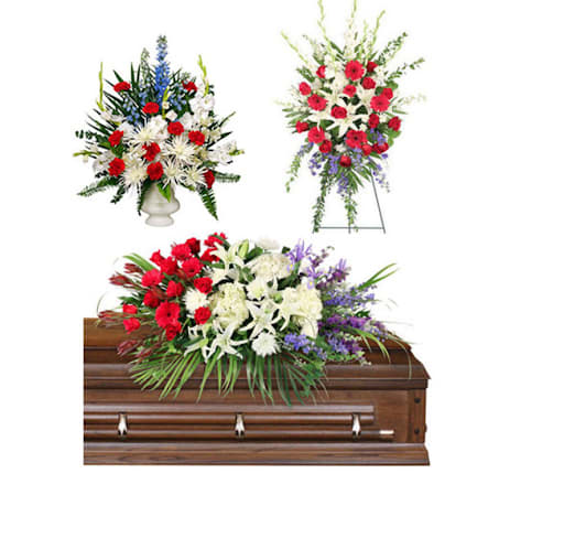 Floral casket spray with red, white, and purple flowers