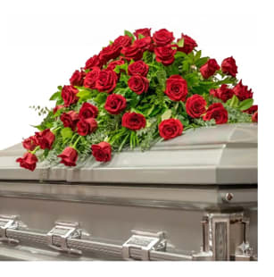 Everlasting Love - A breathtaking casket spray composed entirely of deep red roses, symbolizing enduring love &amp; profound respect.  This luxurious all rose tribute makes a powerful &amp; heartfelt statement of devotion.