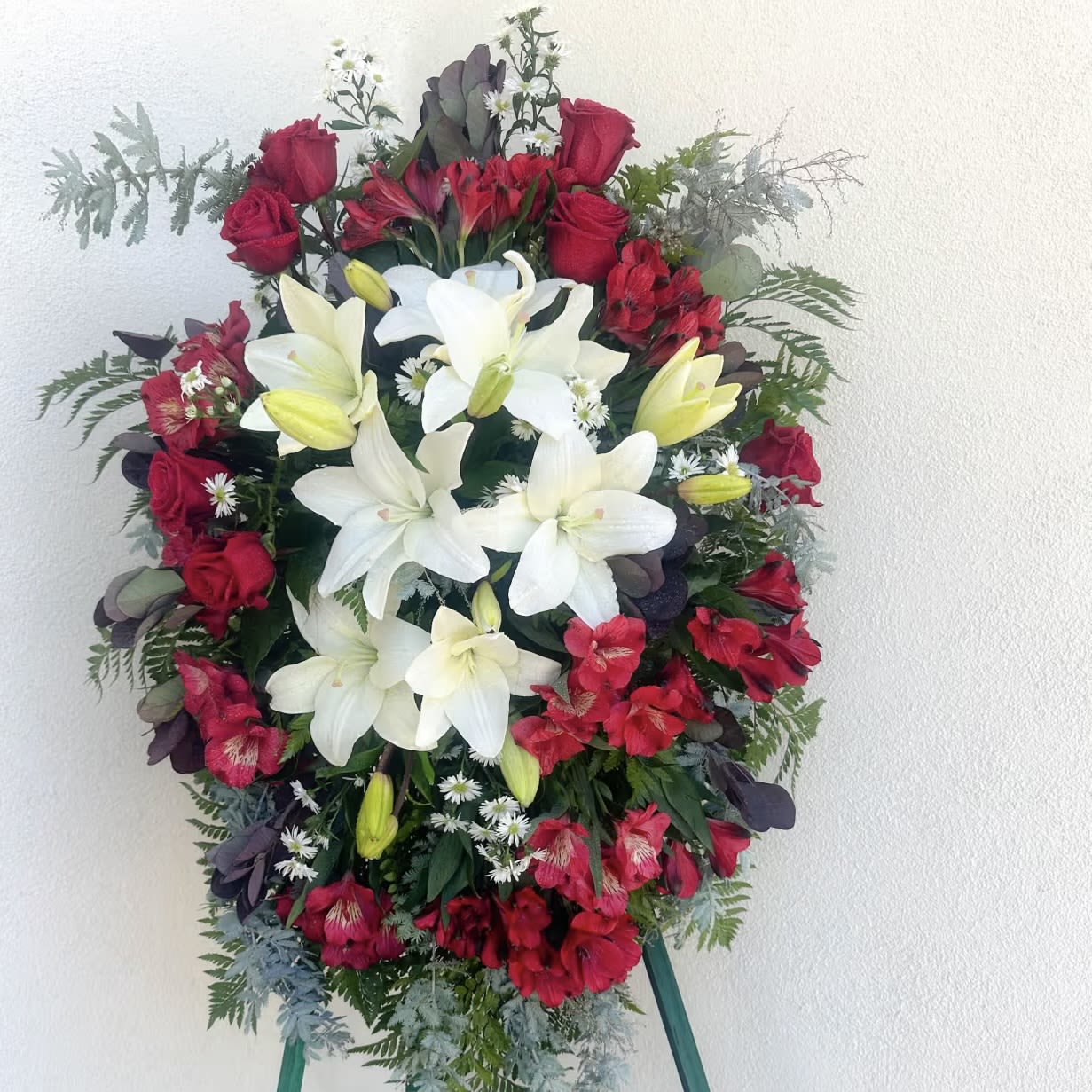 Standing floral spray with white lilies and red roses