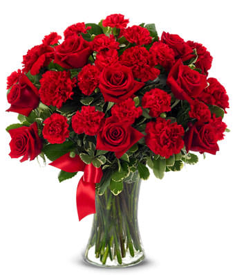 You're Forever In My Heart - Express the thoughts of togetherness you both share, so clearly, so exquisitely. Red roses and red carnations convey heartfelt emotions, accented by a vivid red ribbon...all superbly arranged in a clear gathering vase. Small Measures 16"H by 14"L. Medium Measures 17"H by 15"L. Large Measures 18"H by 16"L.