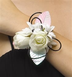 White rose and lily wrist corsage with black loops and pink accents
