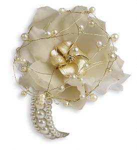 Cream floral corsage with pearl accents and gold wire